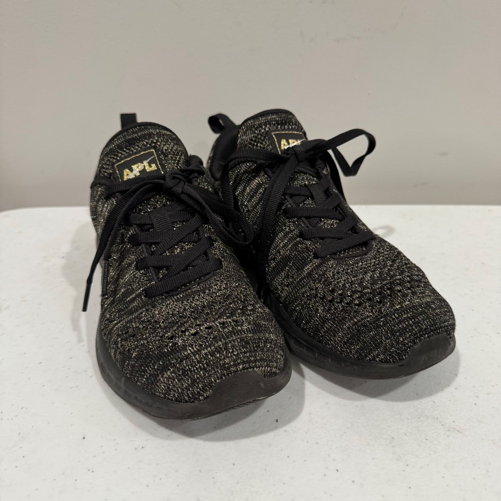 APL TechLoom Pro Womens Running Shoes Size 7 Black Metallic Gold Propelium Knit